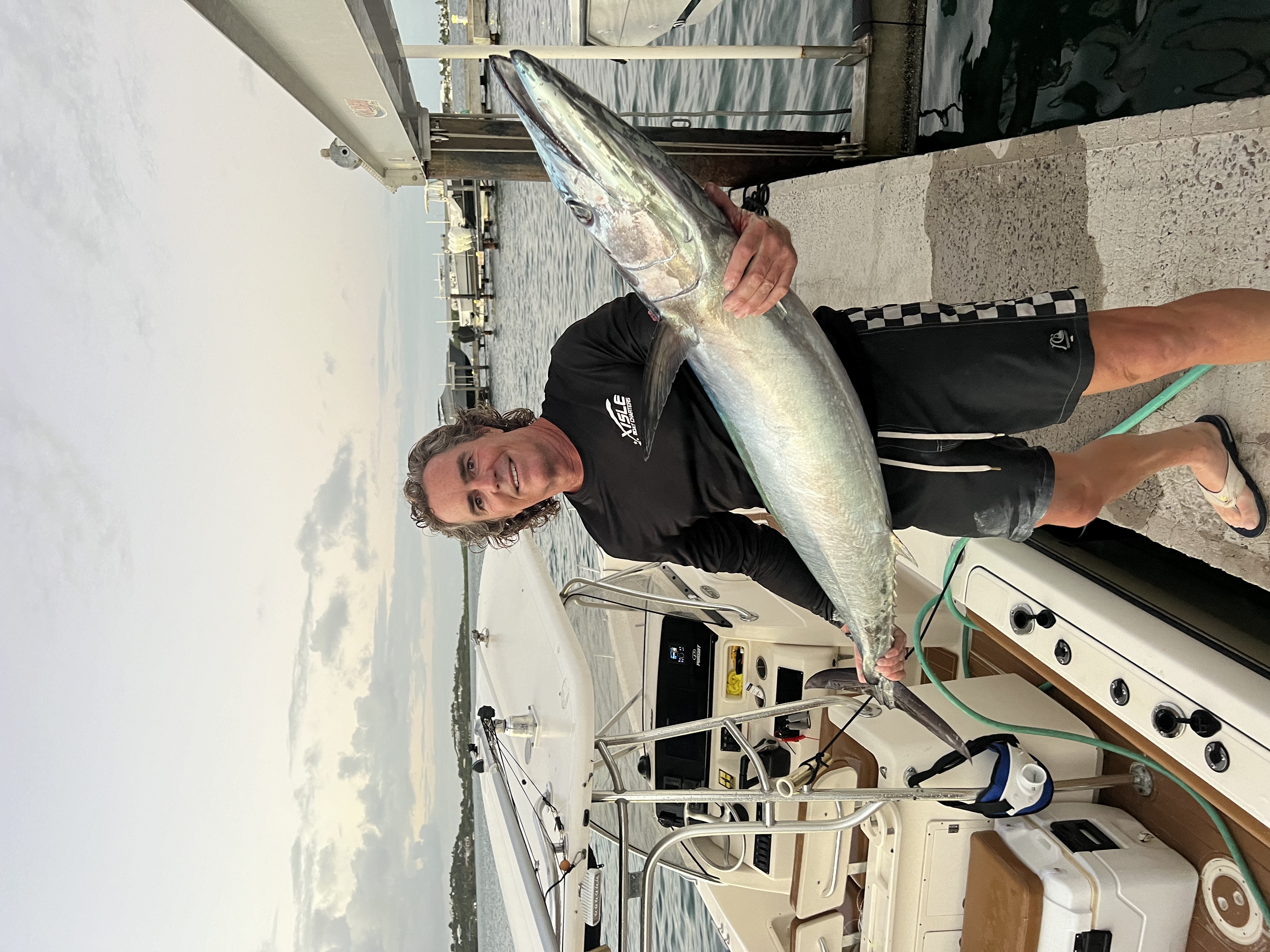Angler with a catch at the dock